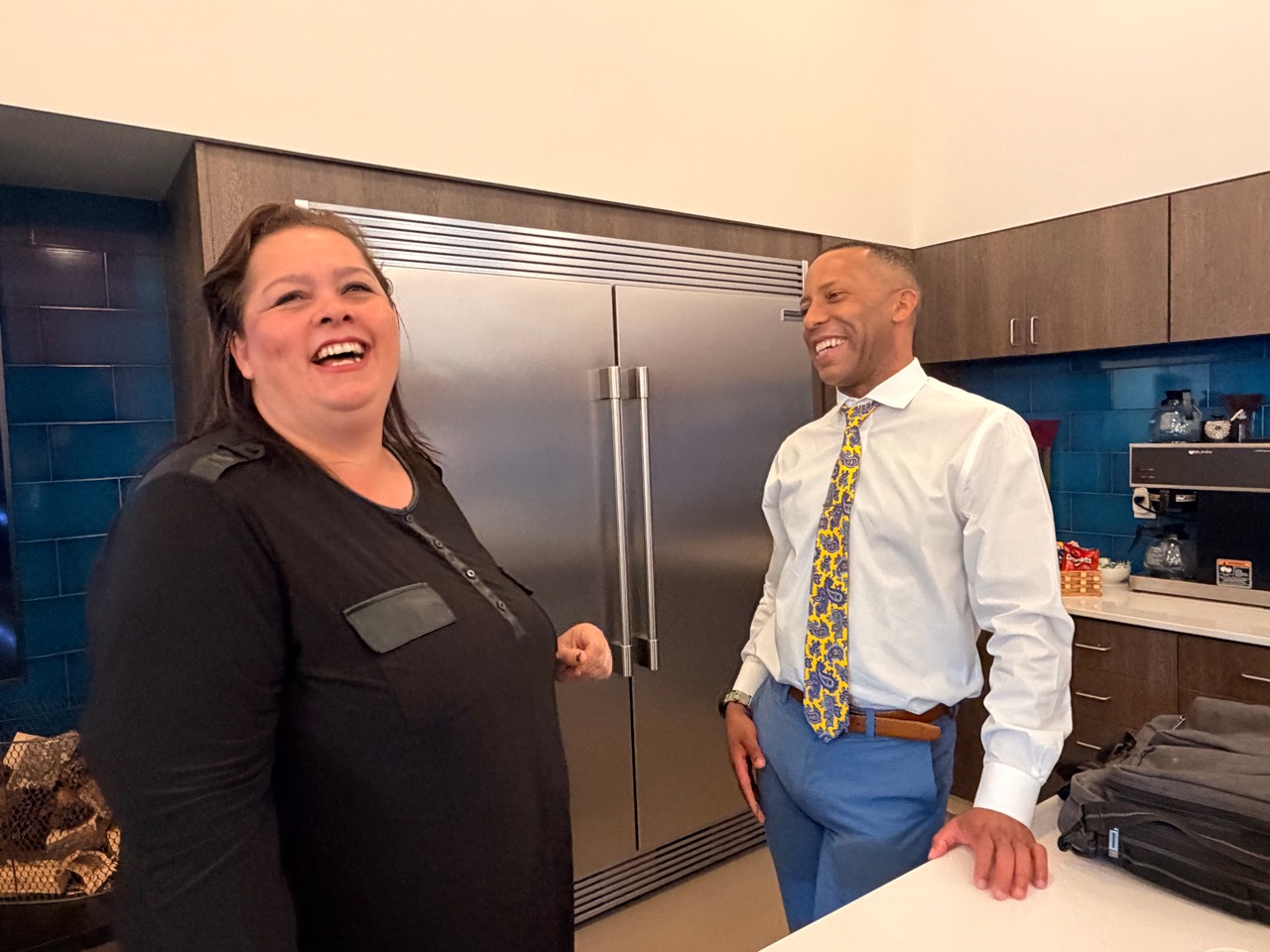 Attendees sharing a candid moment at a previous TREW Community Forum.
