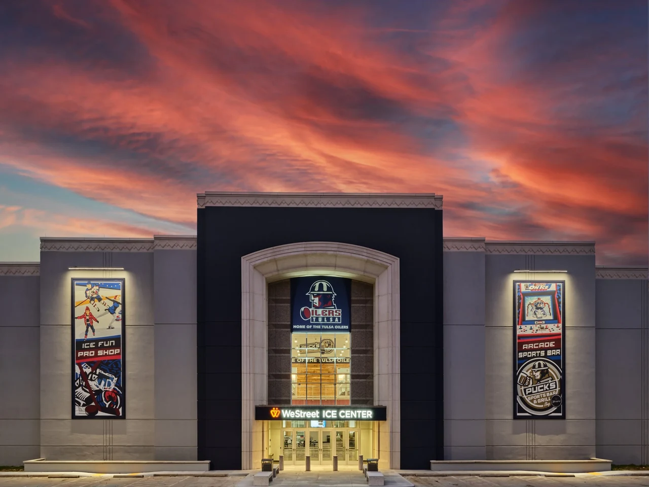WeStreet Ice Center entrance beneath a colorful evening sky